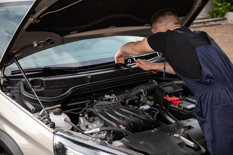 Mechanic using an impact wrench during mobile tire installation